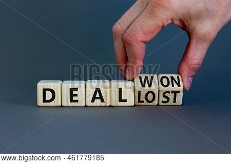 Deal Lost Or Won Symbol. Businessman Turns Wooden Cubes And Changes Words 'deal Lost' To 'deal Won'.
