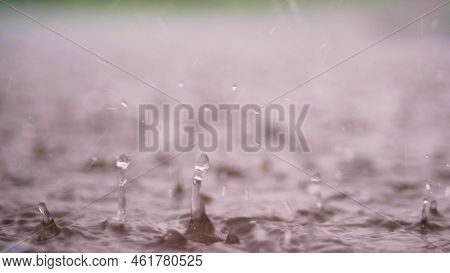Close-up, Large, Heavy Drops Of Rain, Rainfall, Shower, Fall With A Spray, Water Splashes, On The We