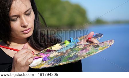 Summer, Outdoors, Portrait Of A Beautiful Forty Years Old Brunette Woman Artist, Close-up Of A Palet
