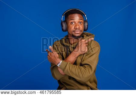 You're Next. Funny African Man Pointing Fingers At Camera Posing Isolated Over Blue Background
