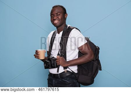 Smiling Heartily Photography Enthusiast Wearing Travel Backpack And Professional Camera Ready For Ho