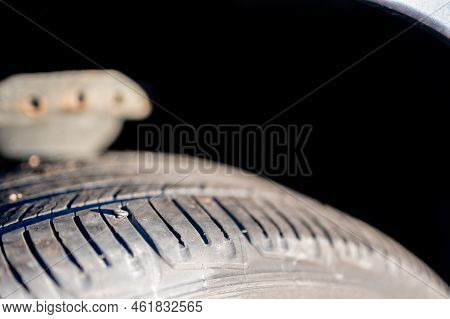Screw Protruding From The Tread Of A Tire Causing A Flat.