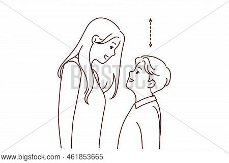 Couple With Different Height Look In Eyes. Tall Woman And Short Man Contrasting Height. Relationship