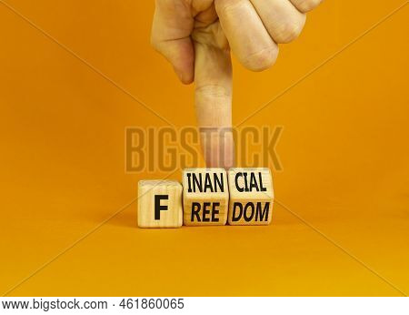 Financial Freedom Symbol. Concept Words Financial Freedom On Wooden Cubes. Businessman Hand. Beautif