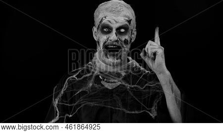 Eureka. Inspired Sinister Man Halloween Crazy Zombie With Bloody Wounded Scars Face Make Gesture Rai