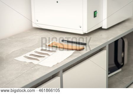 Ultrasonic Cleaner. Preparation Of Medical Tweezers Tools For Ultrasonic Sterilization