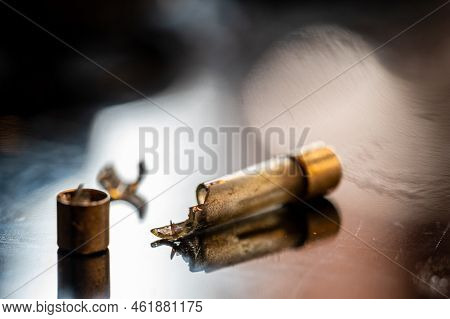 Brown Damaged Fuse That Has Blown And Defective.