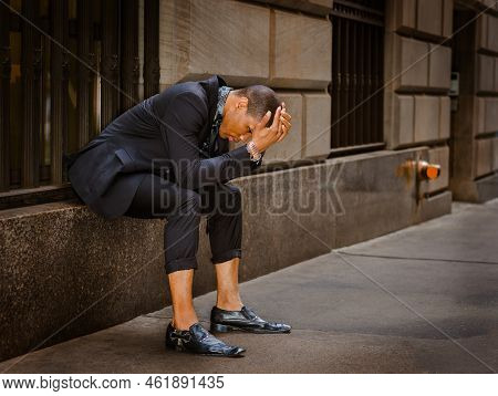 Young African American Man, Wearing Black Suit, Tie, Leather Shoes, Wristwatch, Sitting On Window On