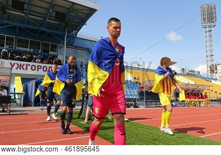 Uzhhorod, Ukraine - August 29, 2022: Metalist Kharkiv And Inhulets Players Go To The Pitch Of Avanha