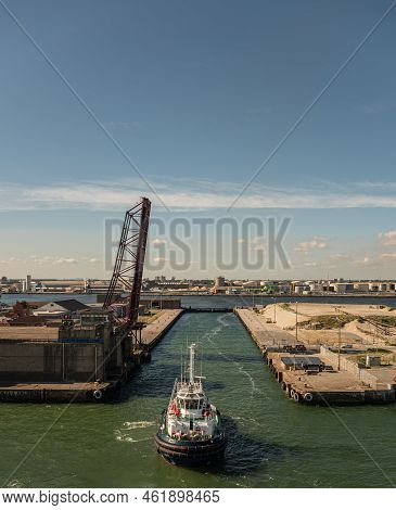 Europe, France, Dunkerque - July 9, 2022: Tugboat Enters Open Canal De Bourbourg Lock To Reach Port 