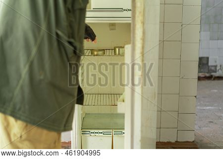 Post Apocalypse. Traveling Man On Foot In A Post-apocalyptic World In Search Of Food.
