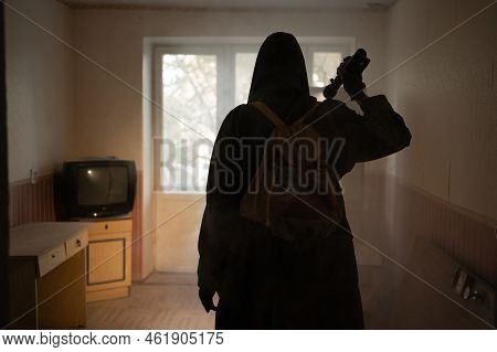 Woman Against The Background Of A Window In A Ruined House And Shining Flashlight, Horror, Fear Conc