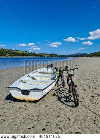 Concept Of Enjoying The Outdoors By Bicycle And Boat At Gweebarra Bay , County Donegal - Ireland