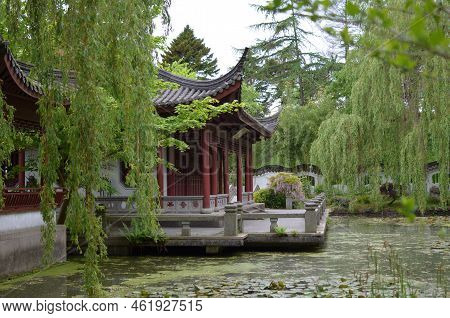 Haren, Netherlands - May 23, 2022: Beautiful View Of Oriental Building Near Pond In Chinese Garden