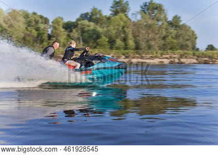 Pripyat, Belarus - Couple Riding A Speedy Jet Ski And Enjoying At The Pripyat River In Belarus In Ju
