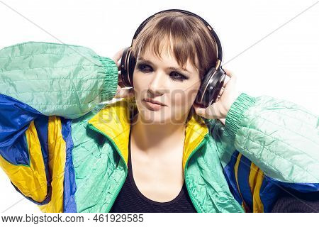 Closeup Portrait Of Young Caucasian Female  Sportwoman In Fitness Outfit Wearing Wireless Phones Whi