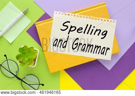 Spelling Grammar. Text On Paper On Yellow And Green Background