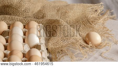 Fresh Organic Chicken Eggs In Carton Pack Or Egg Paper Container On A Sacking. Zero Waste Packaging 