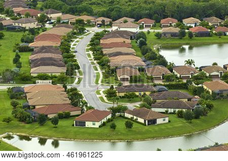 Aerial View Of Tightly Located Family Houses In Florida Closed Suburban Area. Real Estate Developmen