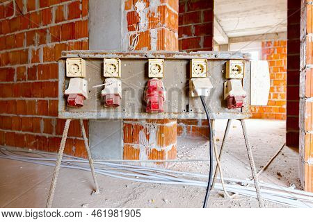 Distribution Panel With Industrial Multiphase Power Plugs And Sockets Are Providing Electrical Energ