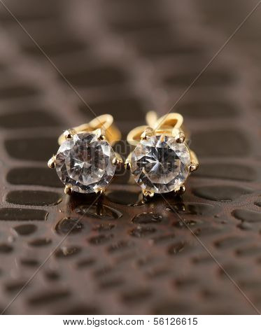gold earrings stud with diamonds macro shot