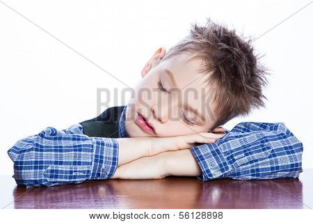Sleeping boy on the table