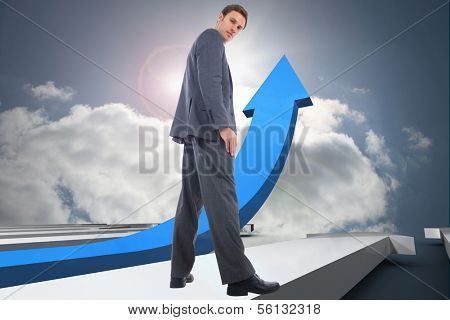 Serious businessman against sunlight lighting up hallway