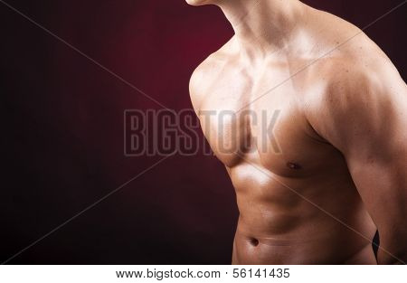 Image of a handsome athletic man on black background