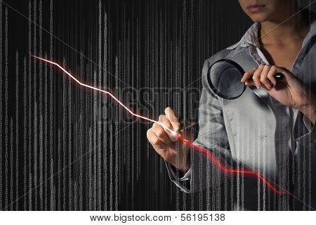 business woman draws a graph