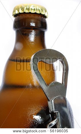 A icecold beer and a bottleopener. All on white background