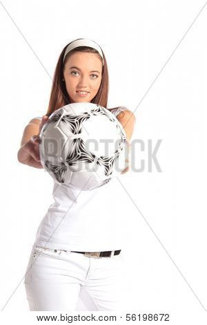 An attractive young woman holding a soccer ball. All isolated on white background.