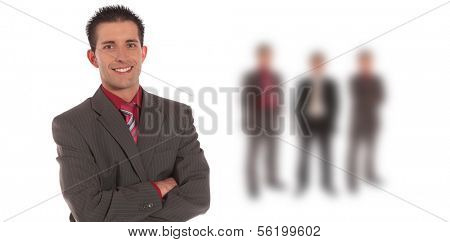 A handsome businessman standing in front of a group of businessmen. All on white background.