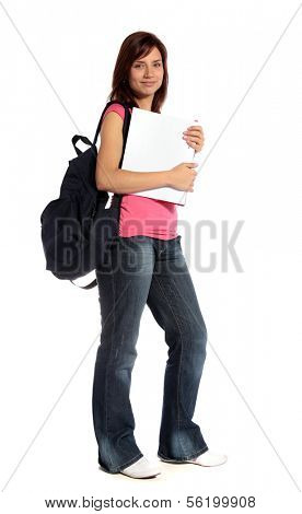 An attractive female student standing in front of a plain white background.