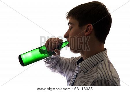 Young Man Drinks A Beer
