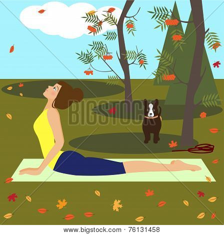 Beautiful Young Girl Practicing Yoga In The Autumn Park
