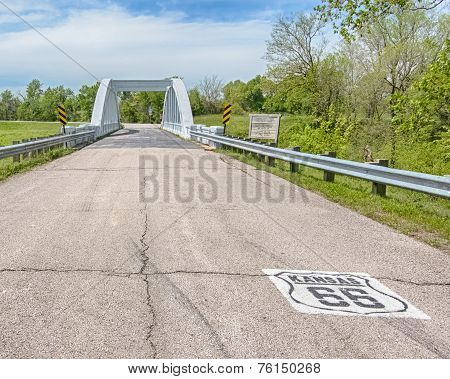 Route 66: Kansas 66 Shield Leads To The Rainbow Curve Bridge, Riverton, KS