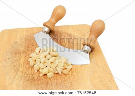 Coarsely Chopped Macadamia Nuts With A Rocking Knife