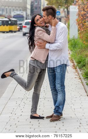 a couple is having fun in a city walk