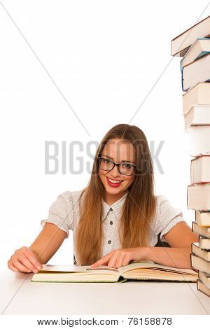 Happy Asian Caucasian Girl Lerning In Study Woth Lots Of Books On The Table