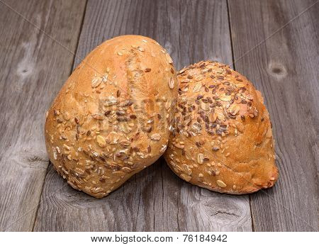 Bread with sesame seeds isolated on wooden background