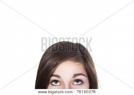 Eyes of brunette woman looking up dumbfounded isolated on white