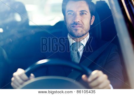 Handsome man driving his car