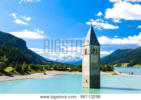 tower of sunken church in Resia lake, South Tyrol, Italy