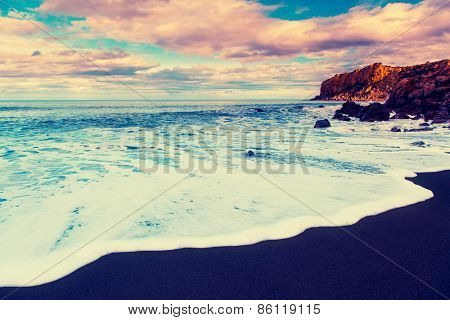 Fantastic view of beach Torre Conca (cape Rais Gerbi). Dramatic scene. Dark overcast sky. Location Cefalu. Tyrrhenian sea. Sicilia, Italy, Europe. Beauty world. Retro style filter. Instagram effect.