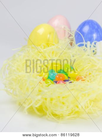 Colorful Easter Eggs And Jelly Belly In Nest