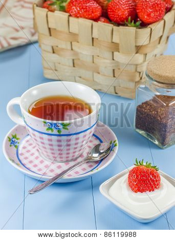 A Cup Of Redbush Tea With A Strawberry-yogurt Dessert