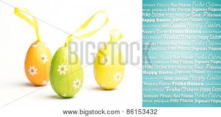 Happy easter in different languages against blue vignette background