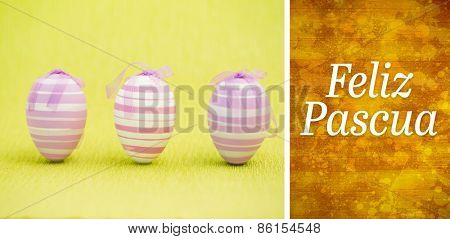 Feliz pascua against yellow paint splashed surface