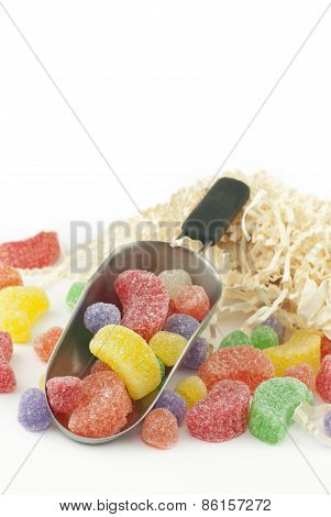 Assorted Candy In A Scoop On White