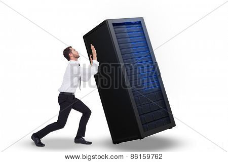 Businessman standing with bent legs and pushing against server tower